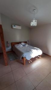 En eller flere senge i et værelse på La casita del colibri