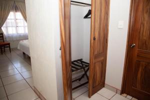 Postel nebo postele na pokoji v ubytování Encanto de la Sierra Hotel