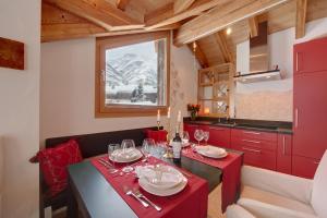 
a dining room table set for a party at Chalet Alpoase in Zermatt
