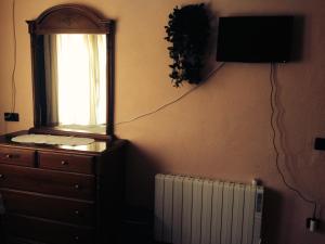 A television and/or entertainment centre at Encanto de Aragón