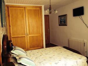 A bed or beds in a room at Encanto de Aragón