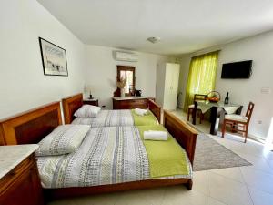 Posteľ alebo postele v izbe v ubytovaní Guesthouse Kresic