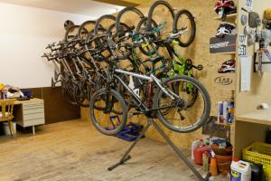 a bunch of bikes hanging on a wall at Gasthof Pension Traube in Karres