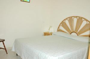 A bed or beds in a room at Appartamenti del Nostromo