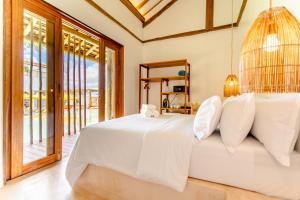Llit o llits en una habitació de Café Jeri Hotel