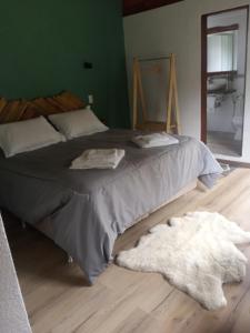 Tempat tidur dalam kamar di Posada La Serena