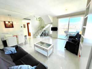 a living room with a couch and a table at Mesana 102 / Penthouse in Calpe