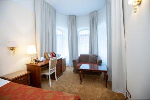 Postel nebo postele na pokoji v ubytování Hotel St. Barbara