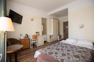 Postel nebo postele na pokoji v ubytování Hotel St. Barbara