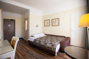 Postel nebo postele na pokoji v ubytování Hotel St. Barbara