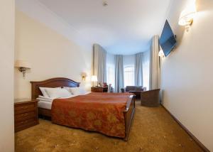 Postel nebo postele na pokoji v ubytování Hotel St. Barbara