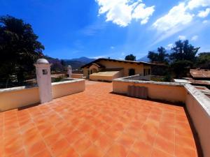 a view of a patio with a building and a tower at Central Hostel in Antigua Guatemala