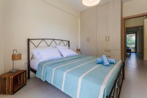 A bed or beds in a room at Armonia Studios Avia 2