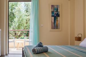 A bed or beds in a room at Armonia Studios Avia 2