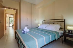 A bed or beds in a room at Armonia Studios Avia 2