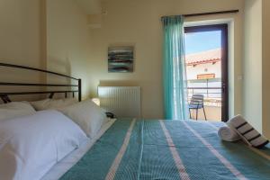 A bed or beds in a room at Armonia Studios Avia 2