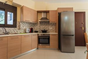 A kitchen or kitchenette at Armonia Studios Avia 2