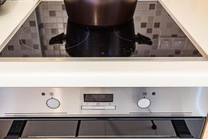 A kitchen or kitchenette at Armonia Studios Avia 2