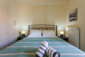 A bed or beds in a room at Armonia Studios Avia 2