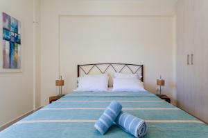 A bed or beds in a room at Armonia Studios Avia 2