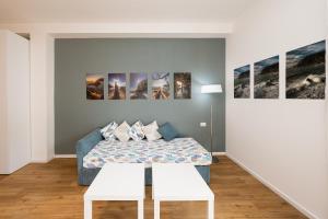 a room with a couch and paintings on the wall at Poseidon Apartment 011019-LT-0180 in Monterosso al Mare