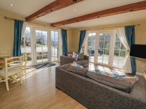 a living room with a couch and a table at Erica's 'eaven in Gillamoor