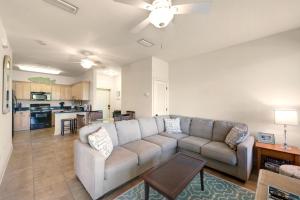 a living room with a couch and a kitchen at Topsail Village 422 in Santa Rosa Beach