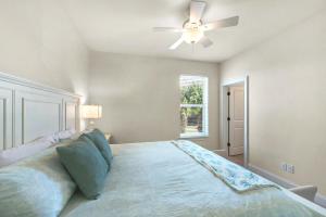 a bedroom with a bed with a ceiling fan at Topsail Village 422 in Santa Rosa Beach +39 photos