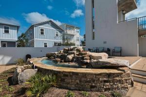 a backyard with a fire pit in the yard at Beachful Bliss in Santa Rosa Beach