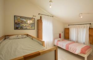 Postel nebo postele na pokoji v ubytování Masia Els Nocs + 37 fotografií