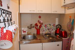 a small kitchen with a sink and a counter at GoVienna - Charming Studio in Vienna