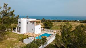 an aerial view of a house with a swimming pool at Villa Mamma Mia in Gennadi