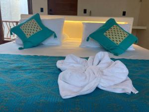 Postel nebo postele na pokoji v ubytování Tikul Hotel Boutique