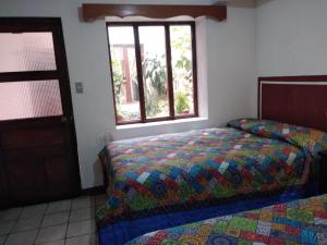 Hotel Casolia tesisinde bir odada yatak veya yataklar