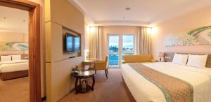 Rúm í herbergi á Vietsovpetro Hotel Dalat