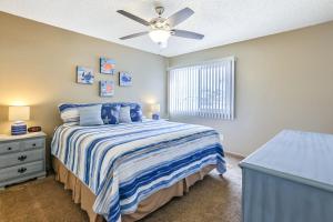 a bedroom with a bed and a ceiling fan at Ramona Memories in Grover Beach
