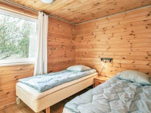 Cama ou camas em um quarto em Holiday Home Fjordternevej