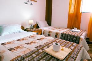 Cama ou camas em um quarto em Hostal Mi Peru
