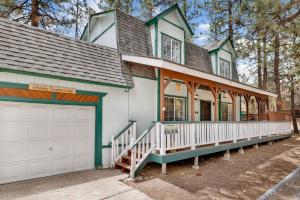 a house with a white and green at Whiskey Mountain Lodge #2028 by Big Bear Vacations in Sugarloaf