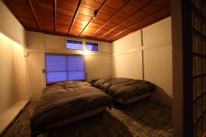 Krevet ili kreveti u jedinici u objektu HEM'S HOTEL 1日1組限定 new