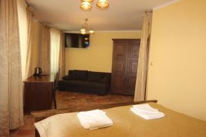 Voodi või voodid majutusasutuse Hotel Pelikán toas