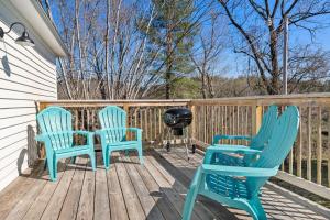 two blue chairs and a grill on a deck at *NEW! The Rectory, King Bed, Home Theater, Deck, BBQ, Fire Pit in Marshall