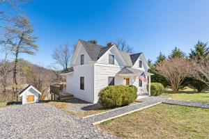 a white house on a gravel driveway at *NEW! The Rectory, King Bed, Home Theater, Deck, BBQ, Fire Pit in Marshall