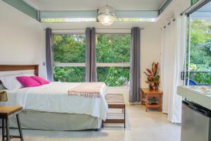 Postel nebo postele na pokoji v ubytování Agutipaca Bungalows + 37 fotografií