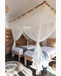 Postel nebo postele na pokoji v ubytování Mana Eco Retreat