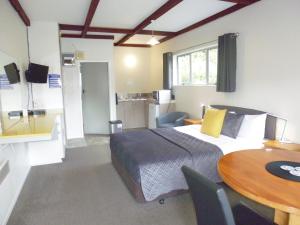 Postel nebo postele na pokoji v ubytování Spa Lodge Motel