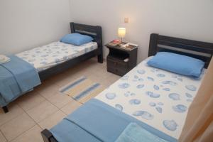 Postel nebo postele na pokoji v ubytování ANALIPSI apartment No1 - MAKRY GIALOS-CRETE