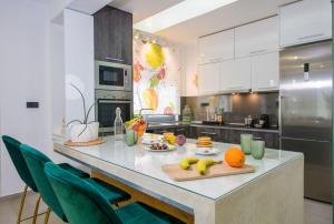 a kitchen with a counter with fruit on it at Villa Alyona in Skinés