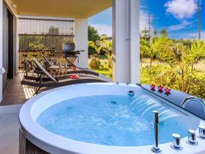 a jacuzzi tub on the patio of a house at Grace Villa Miyakojima - Vacation STAY 60494v in Uechi