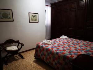 A bed or beds in a room at Osteria dei Locandieri